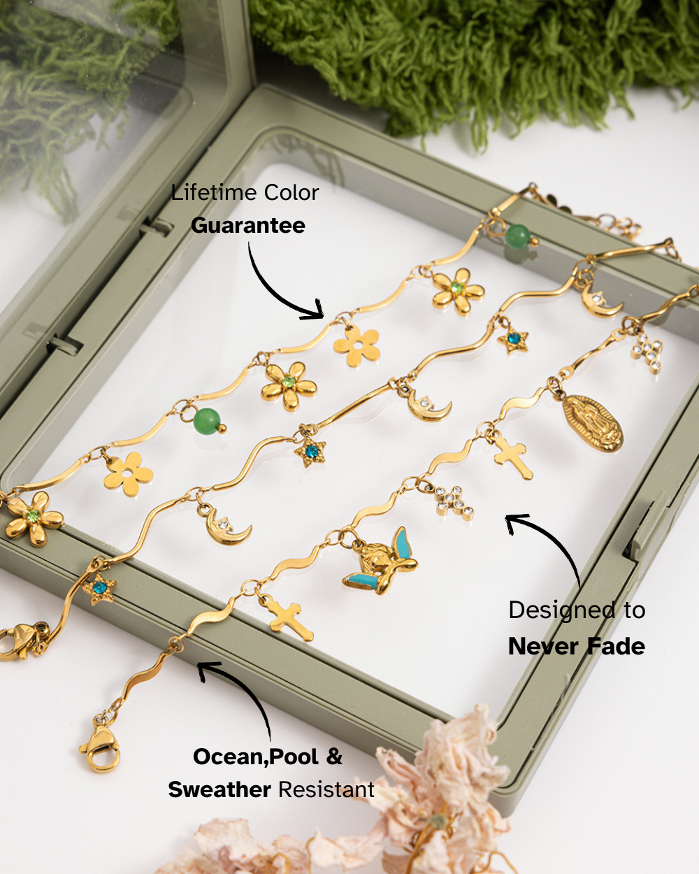 Gold necklace with floral and butterfly designs in a display box, featuring text about product guarantees and features.