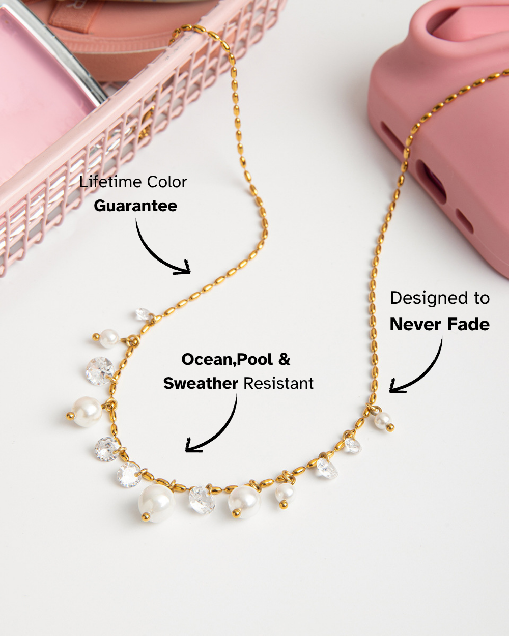 Gold necklace with pearls on a white background, featuring text about color guarantee and weather resistance.