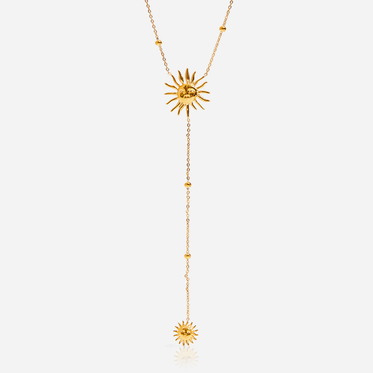 Gold necklace with sunflower pendants on a white background