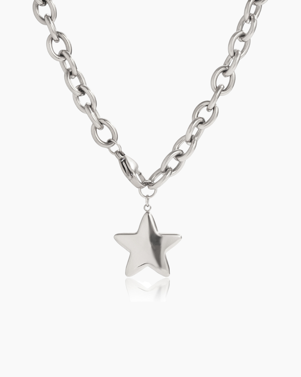 Silver star pendant on a chain against a white background
