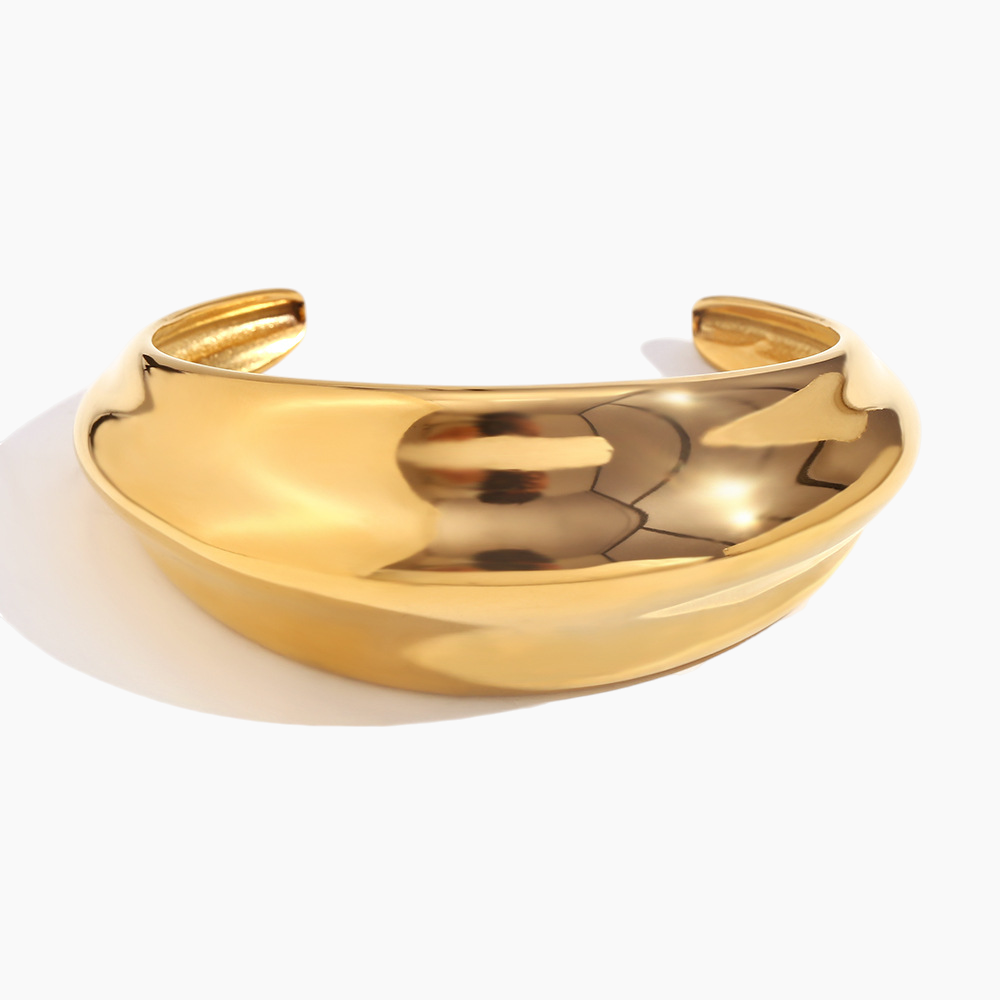 Gold bracelet on a white background