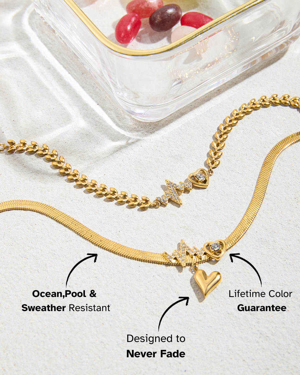 Gold necklace with charms on a white surface with text about features.