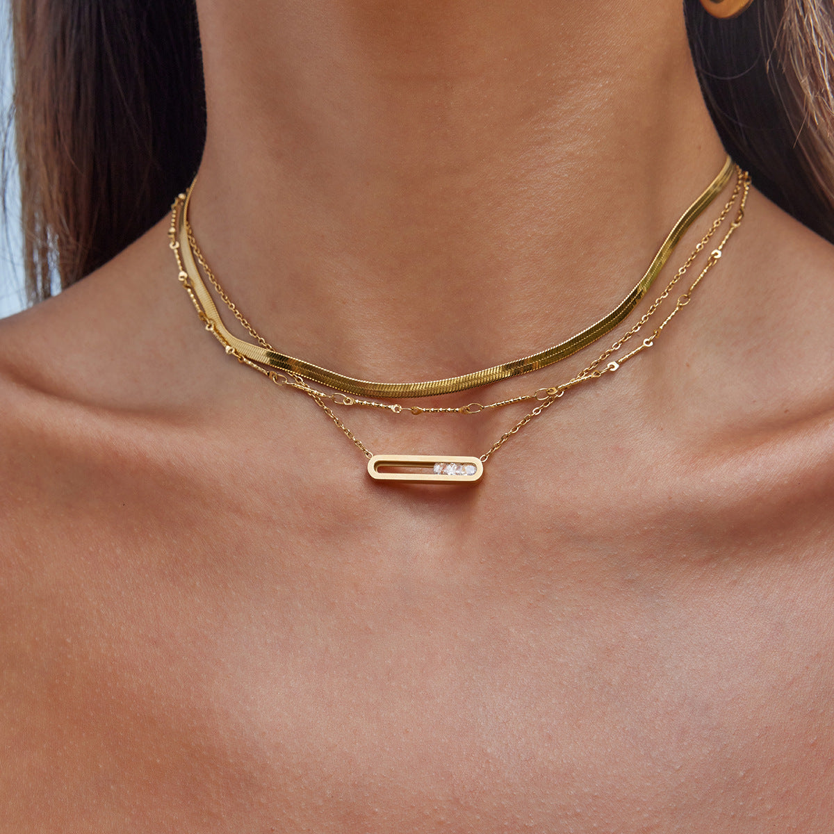 Elegant gold choker with inset clear crystals on model