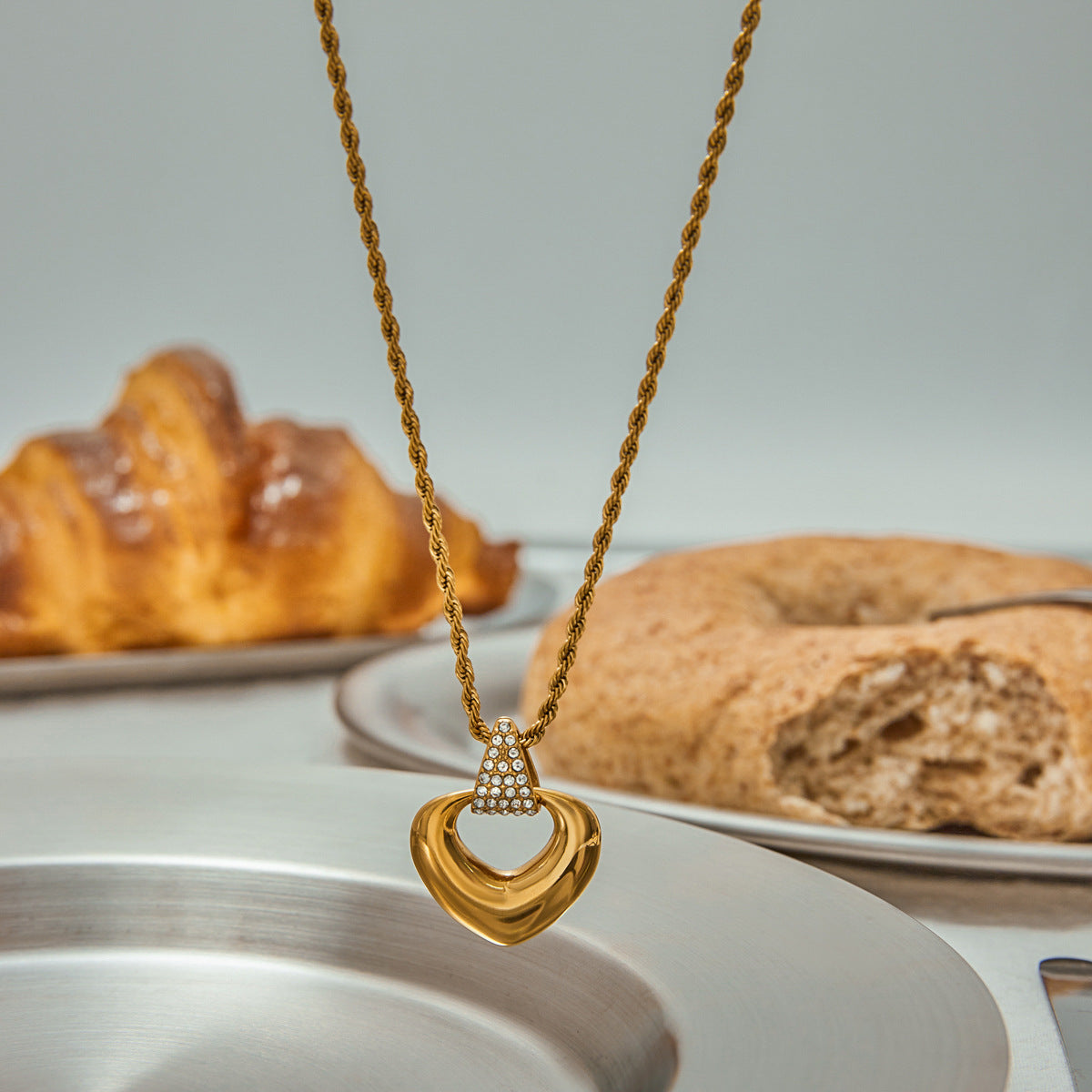 Close-up of golden heart pendant on delicate chain_MiFJewelry