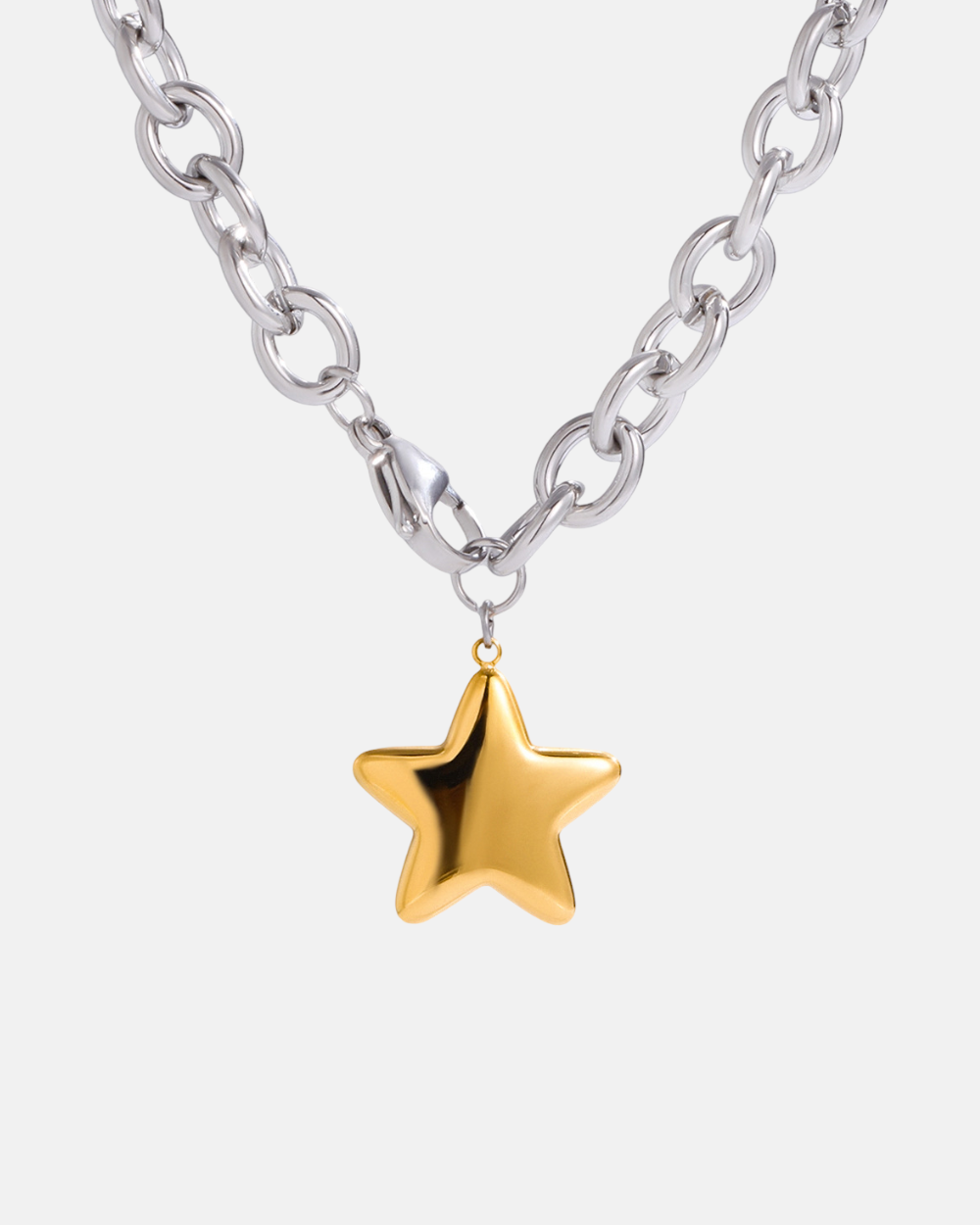 Gold star pendant on a silver chain against a white background