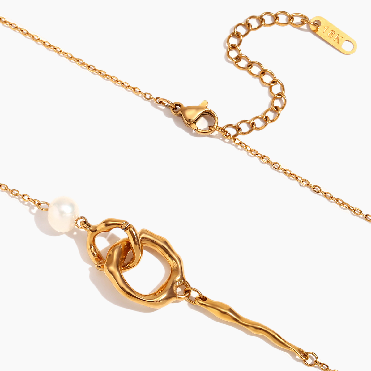 Gold bracelet with a unique clasp design on a white background