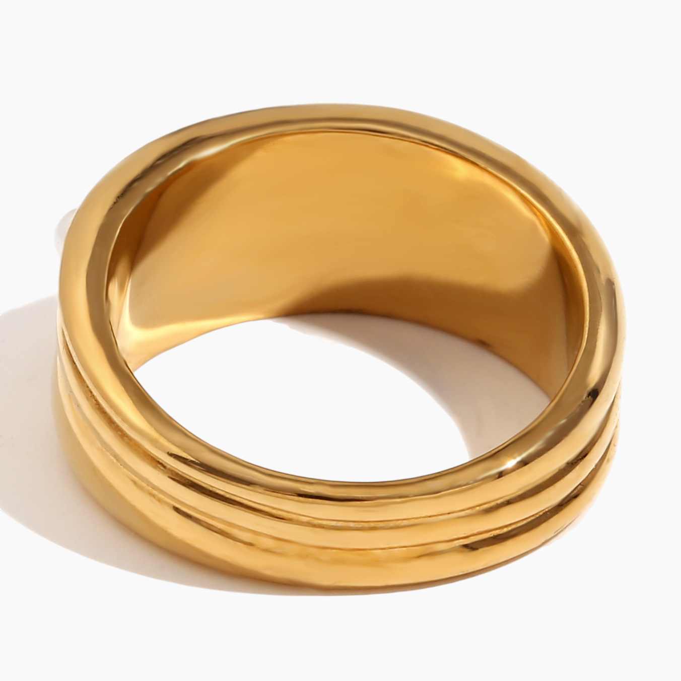 Gold ring on a white background