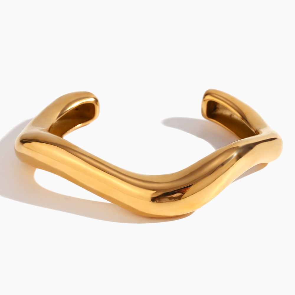 Gold bracelet on a white background