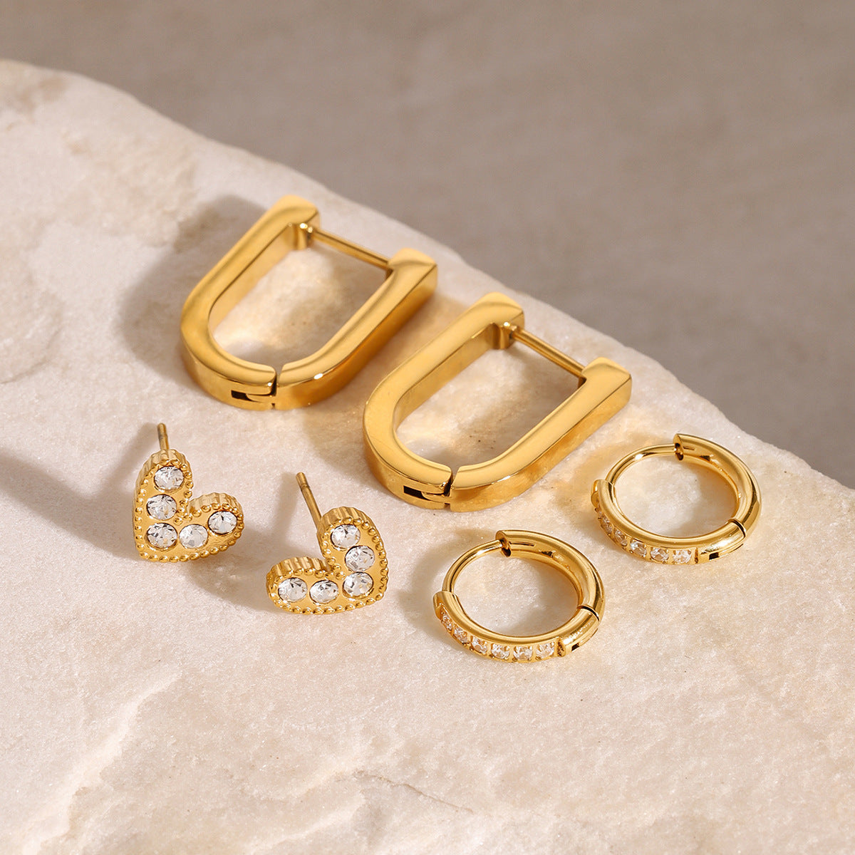 Chunky gold rectangular hoop earrings with clean modern shape, minimal chic style