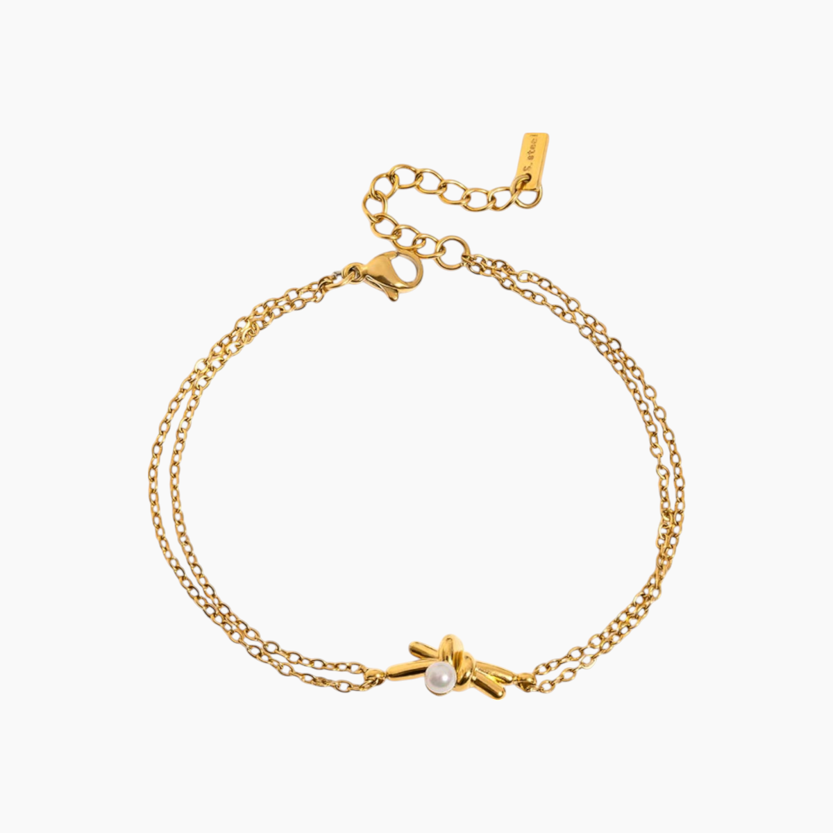 Gold bracelet with a small pearl charm on a white background