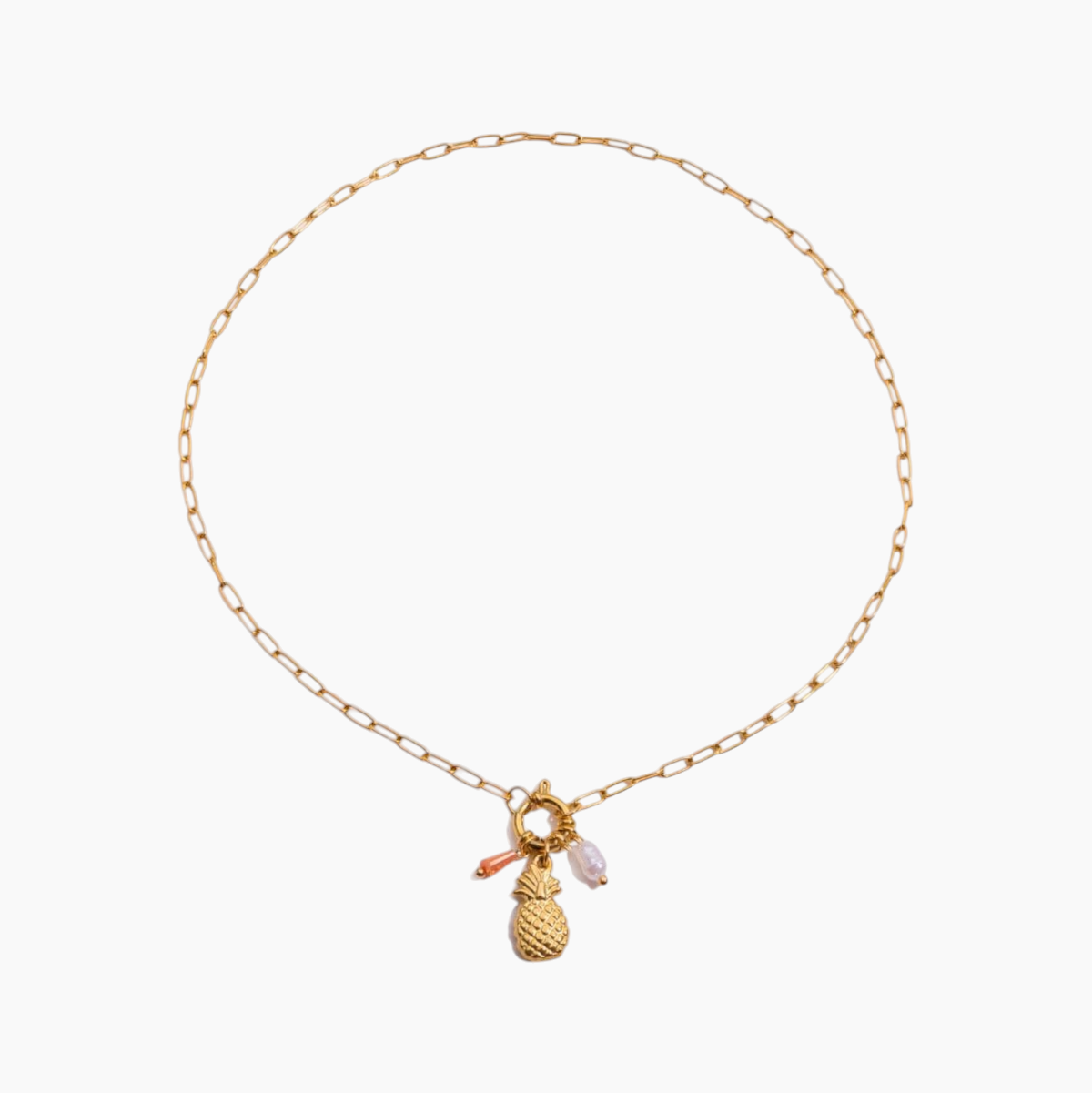 Gold necklace with pineapple charm on a white background