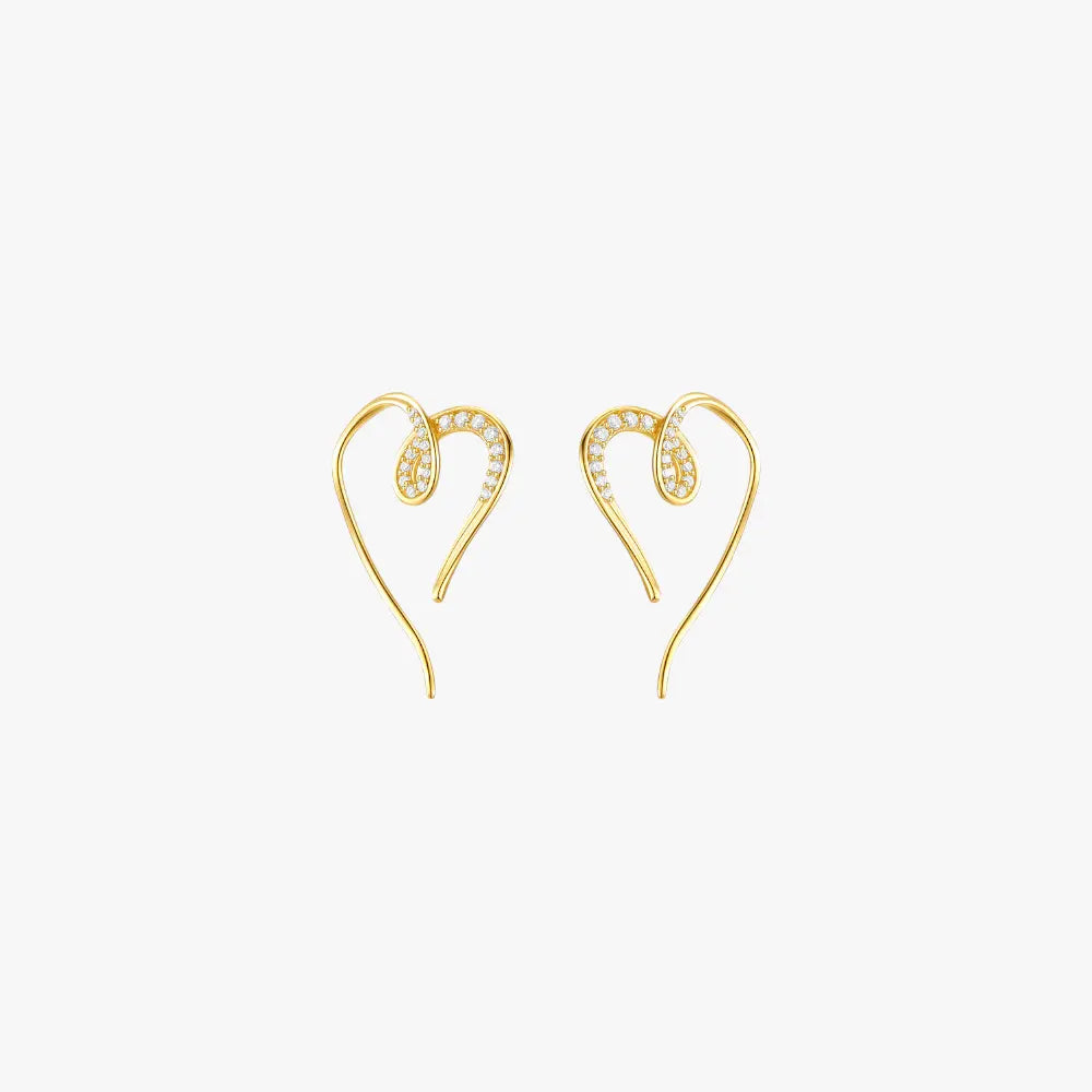 A pair of gold heart hoop earrings.