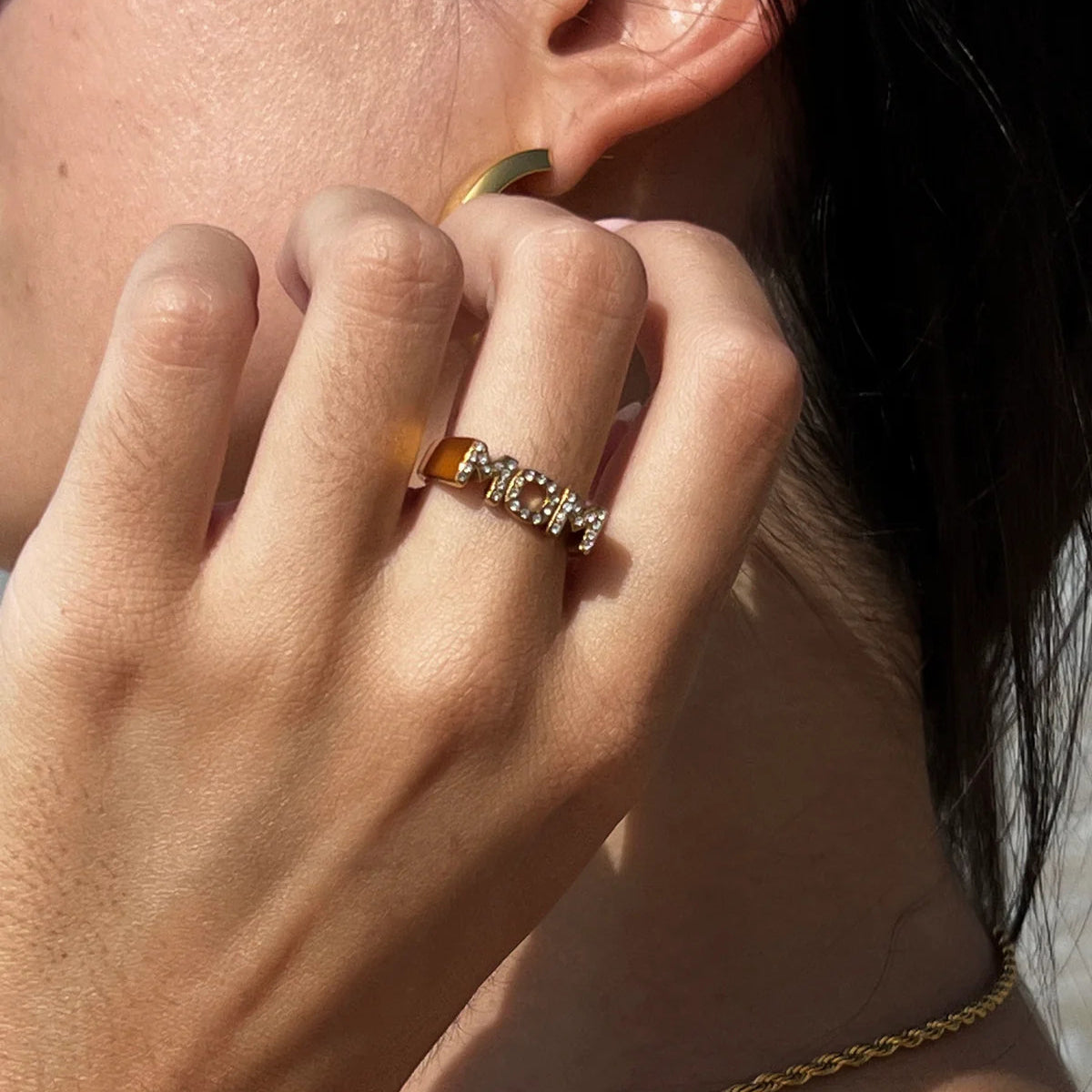Gold crystal MOM ring worn by model, elegant gift jewelry for stylish moms
