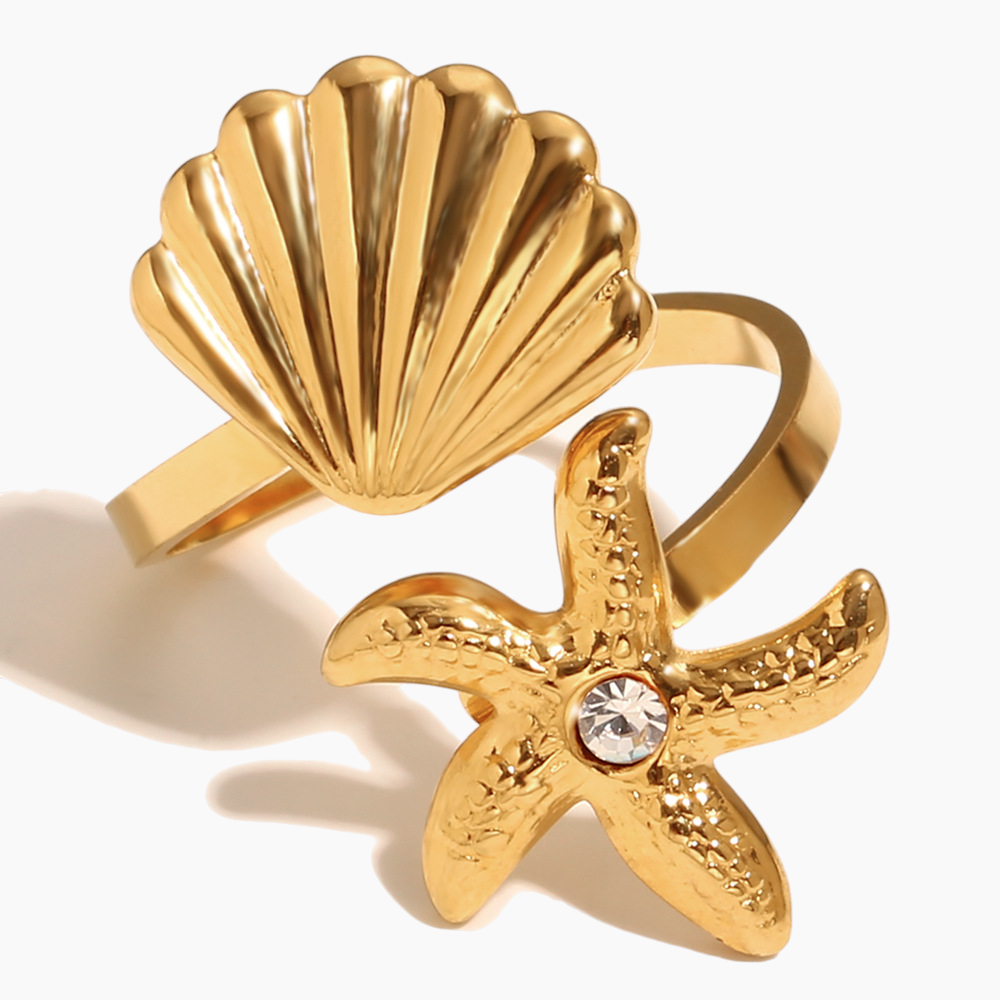 Adjustable gold seashell ring shining in natural beach sunlight