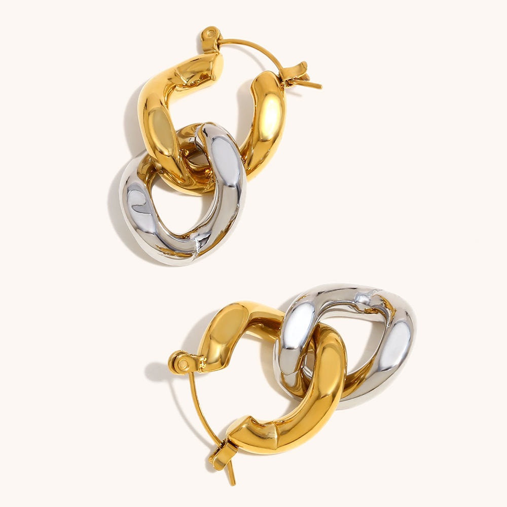 Gold and silver layered hoops featuring twisted metal links