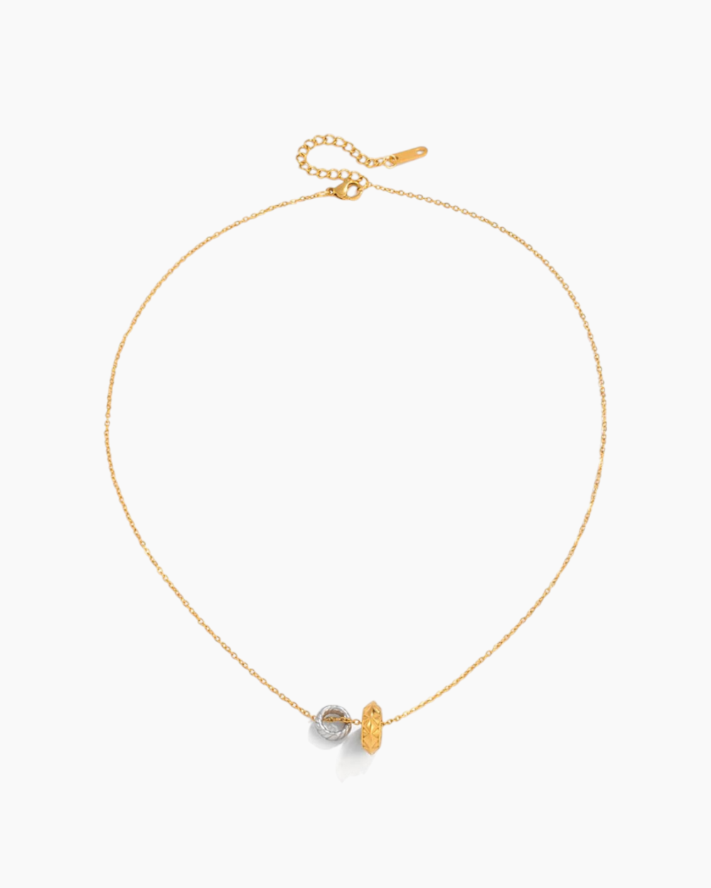 Gold necklace with a small pendant on a white background