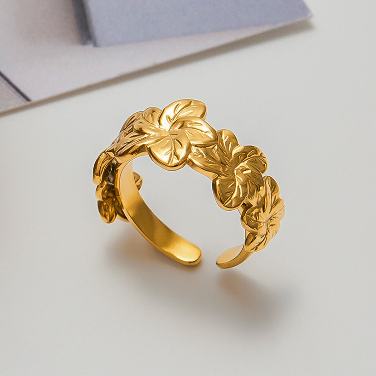 Everyday look with Golden Bloom Everyday Ring matched with stacked bands in minimalist outfit