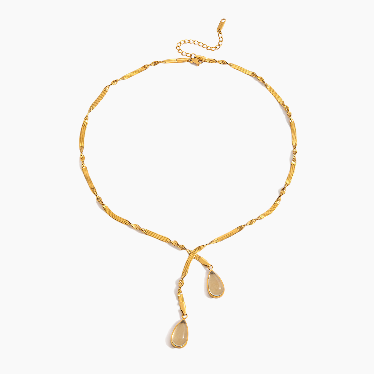 Gold necklace with teardrop pendants on a white background