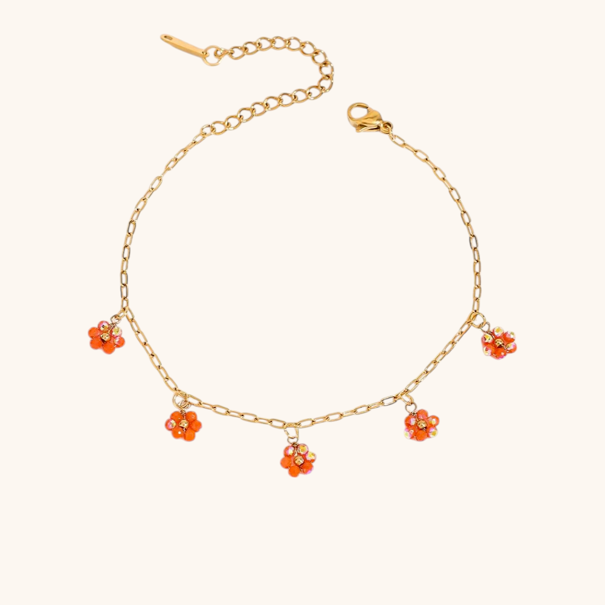 Orange beaded flower bracelet with adjustable chain clasp shown with flowers