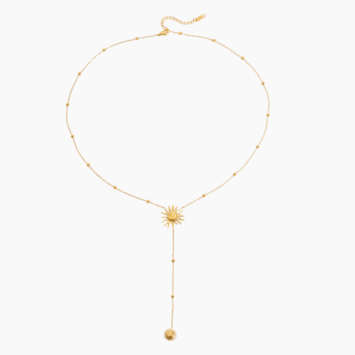 Gold necklace with a sunflower pendant on a white background
