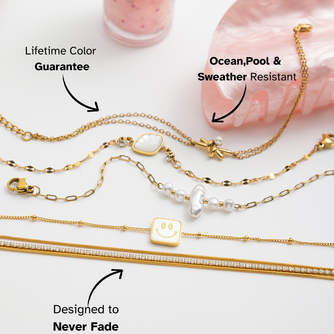 Gold necklaces with various pendants on a white background, featuring text about color guarantee and resistance to ocean, pool, and weather.