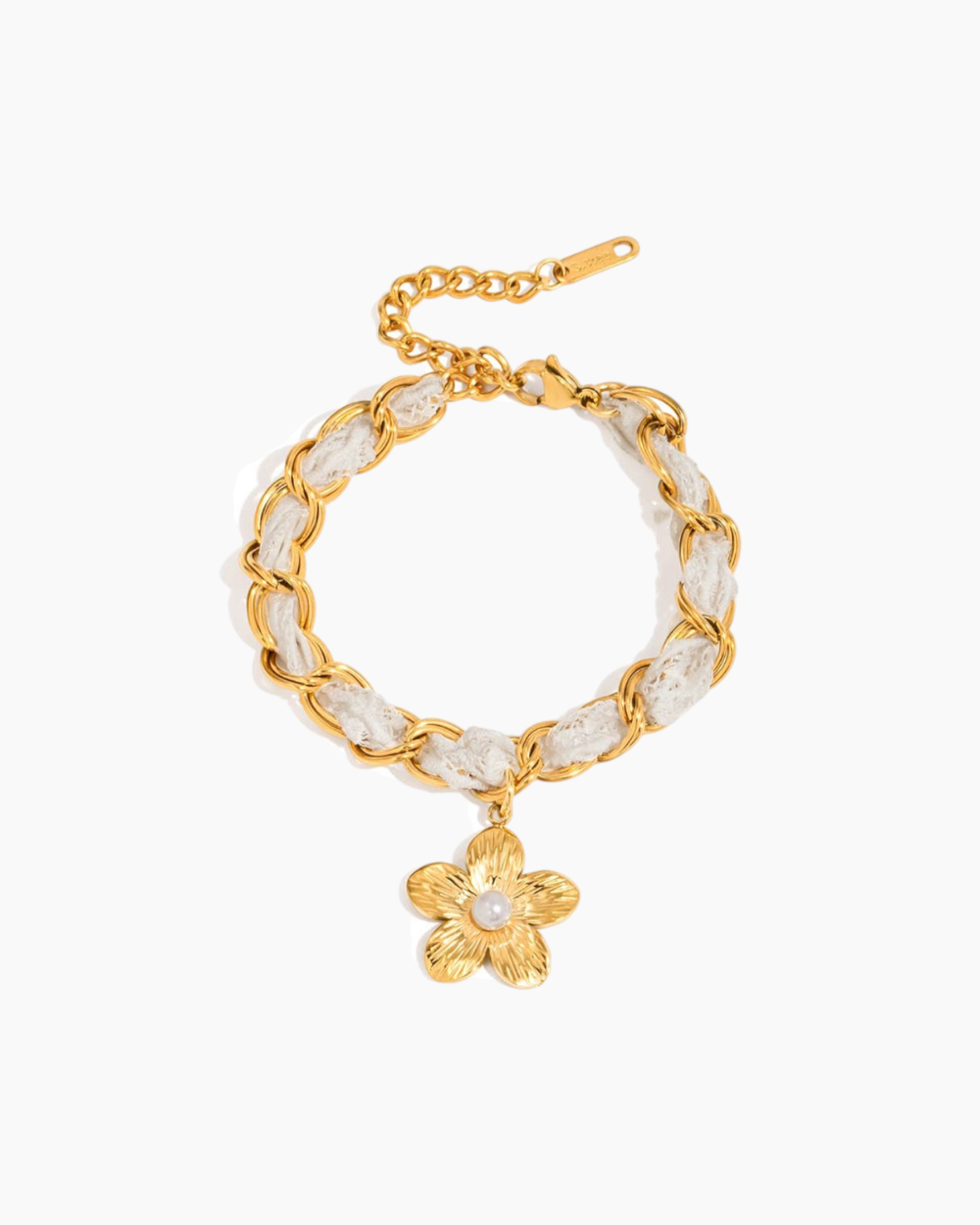Gold bracelet with a floral charm on a white background