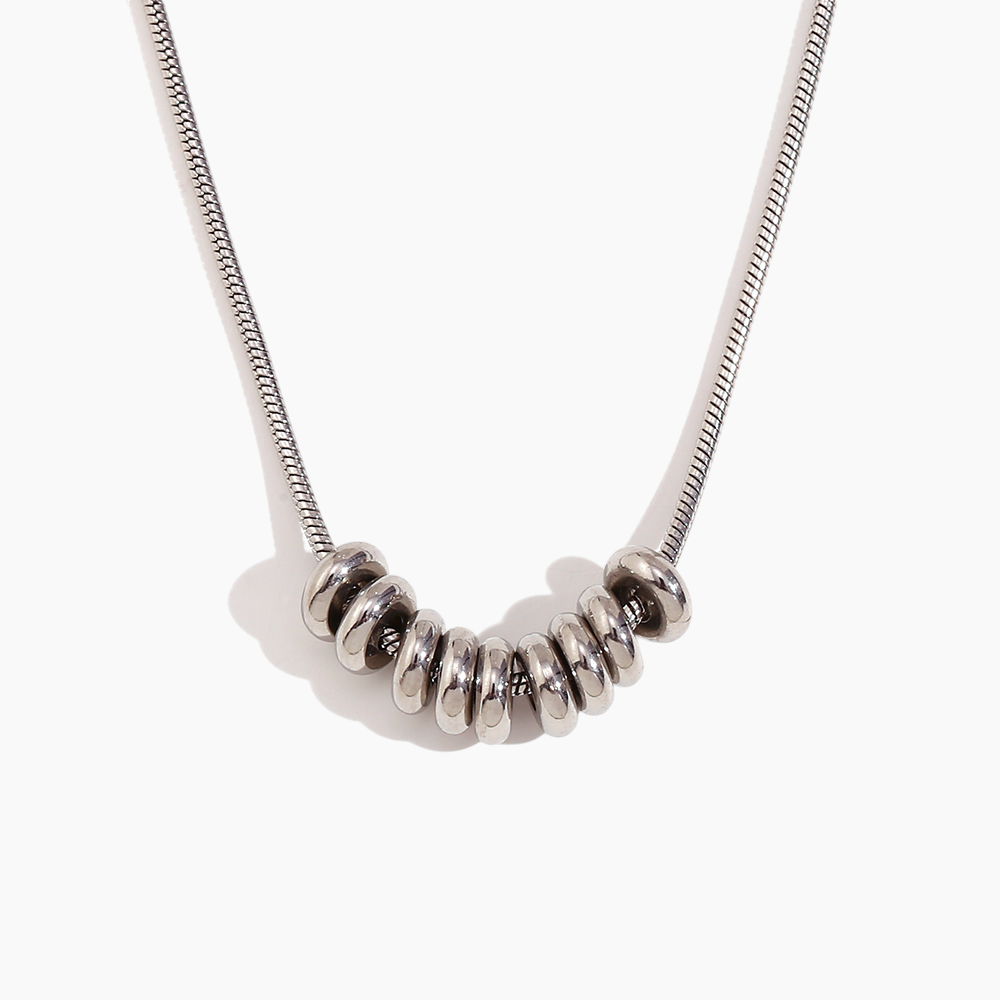 Silver necklace with a unique pendant on a white background