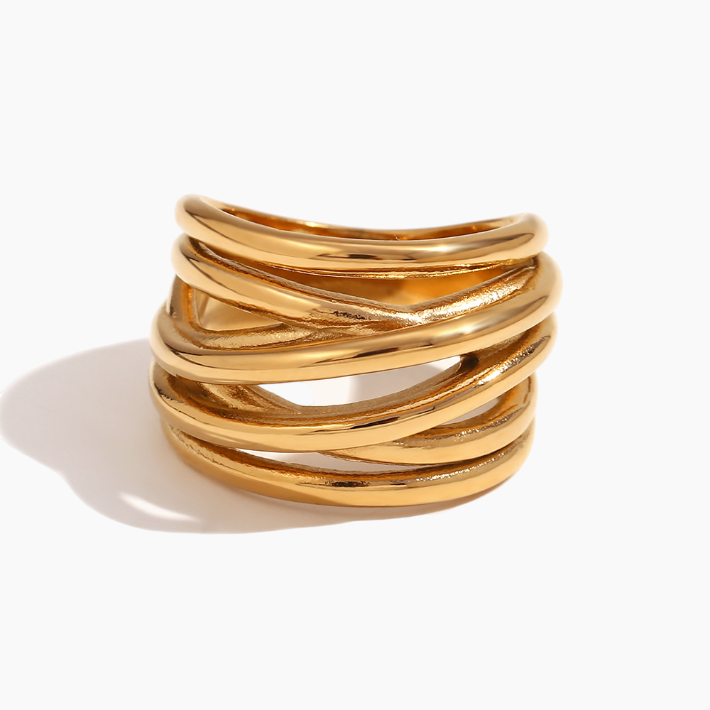 Gold ring with multiple bands on a white background