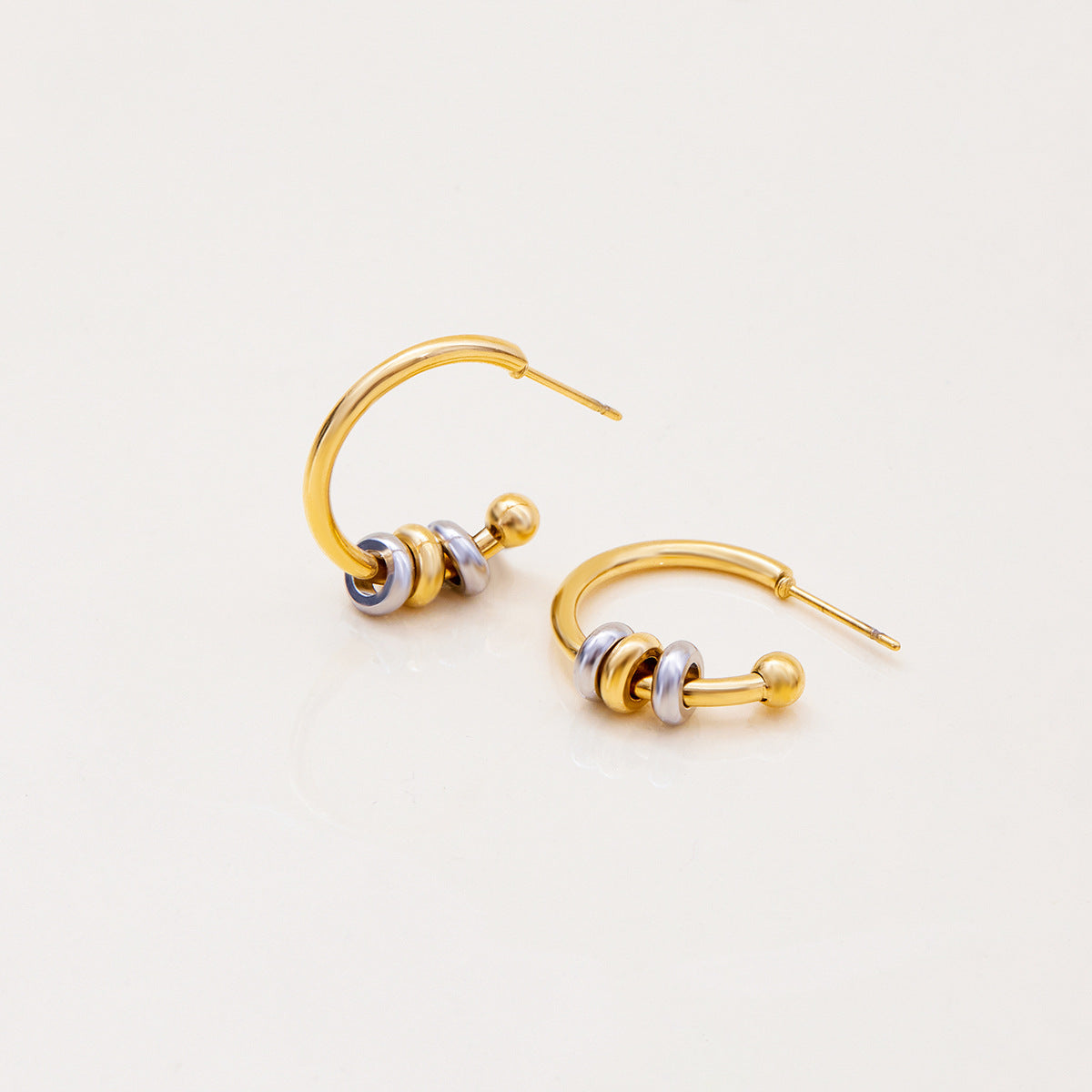 Minimalist gold and silver hoops for daily wear