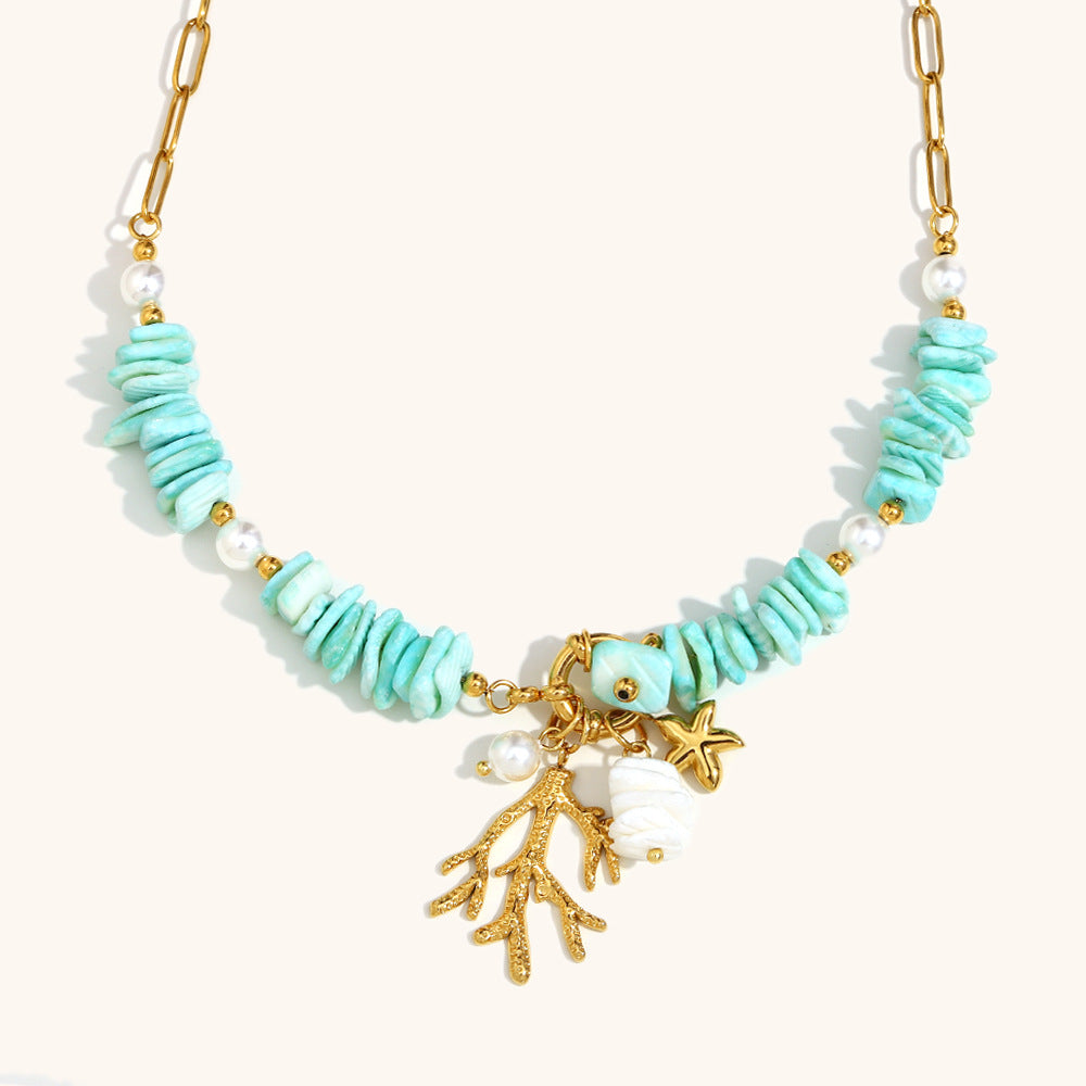 Fashion model styled in a coastal-inspired turquoise statement necklace