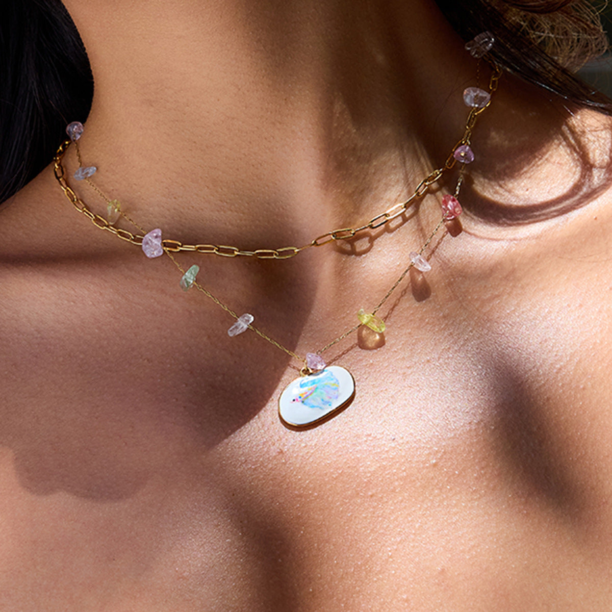 Gold and crystal layered necklace with enamel fish charm, perfect for beach outfits