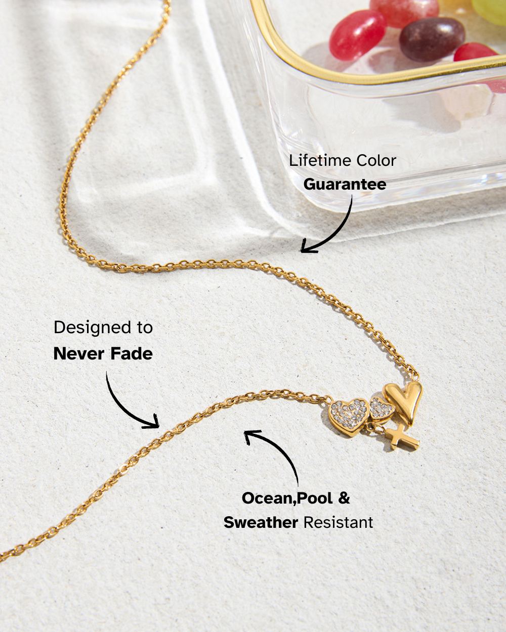 Gold necklace with butterfly pendant on a white background, featuring text about its features.