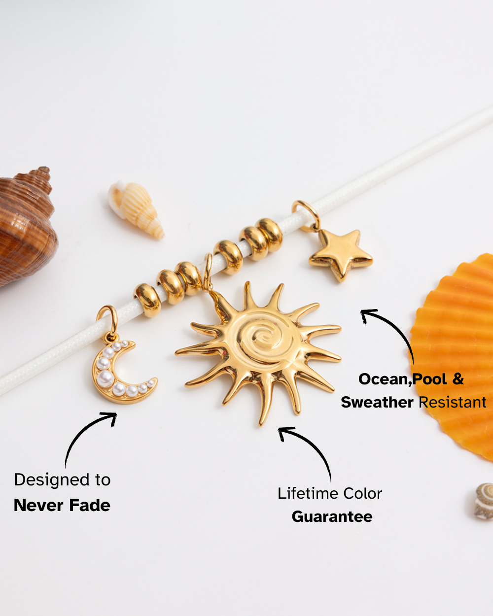 Gold sun-shaped pendant with moon and star charms on a white background with shell decorations.