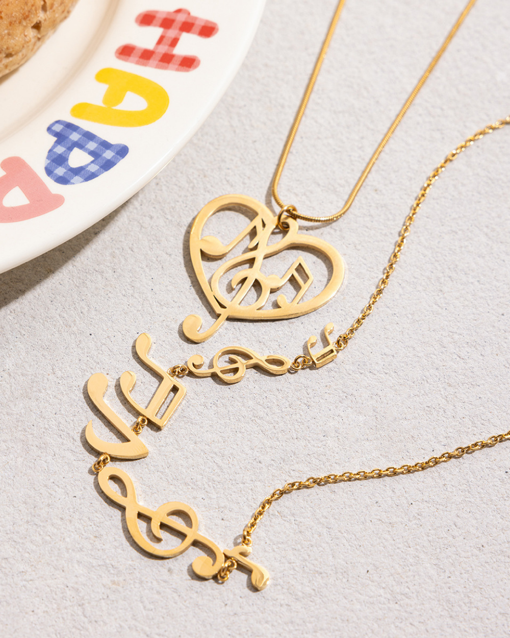 Gold heart-shaped earring with '14k' marking on a white background