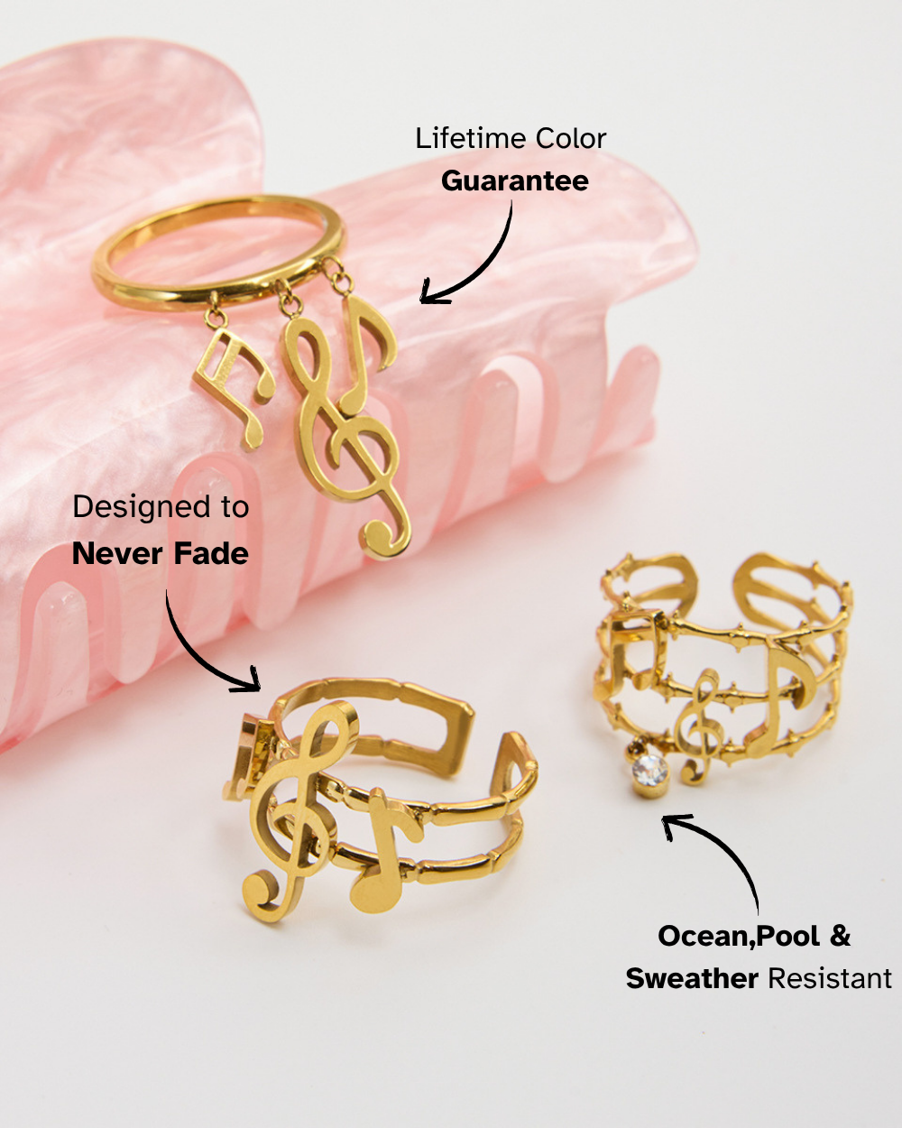 Gold rings with musical symbol on a pink background, featuring text about color guarantee and resistance to fading.