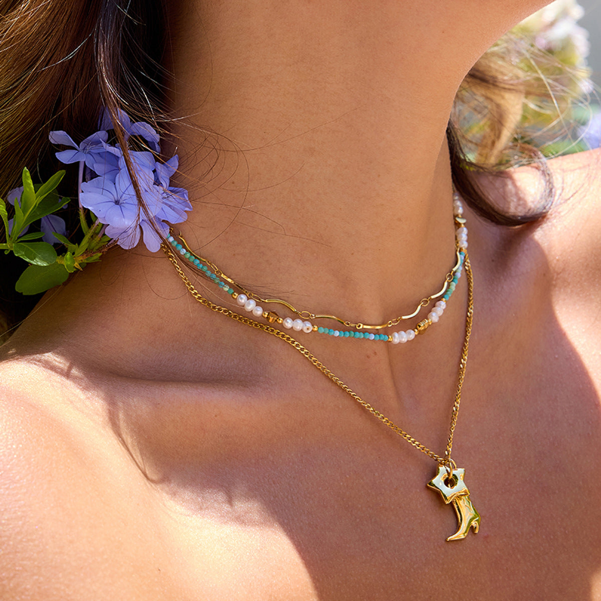 waterproof necklace styled on model for summer layering