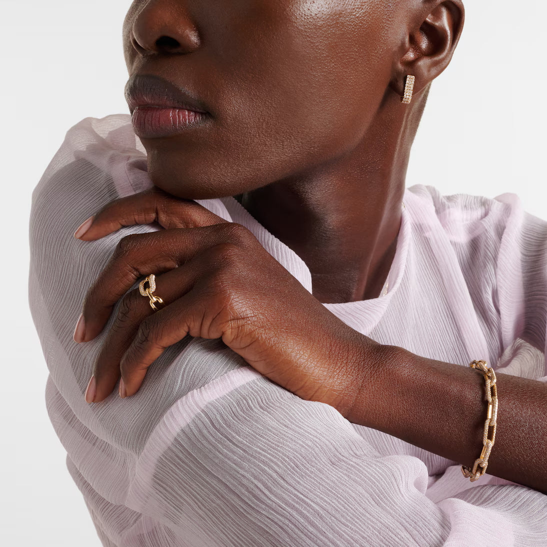 African American model wears crystal chain link ring and matching bracelet for a sophisticated everyday look.