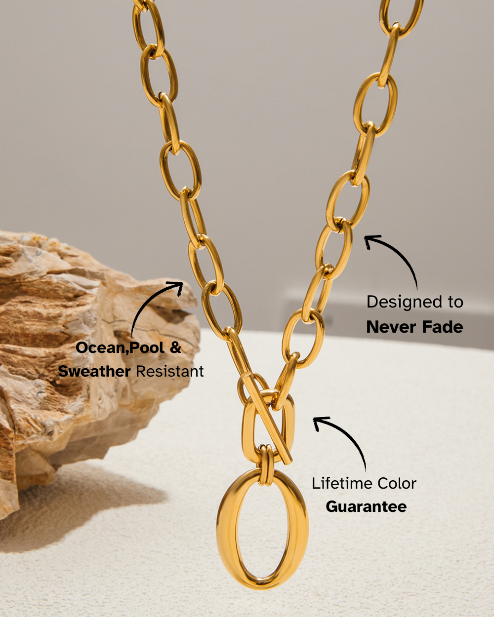 Gold chain necklace with text on durability and color guarantee, placed on a neutral background.
