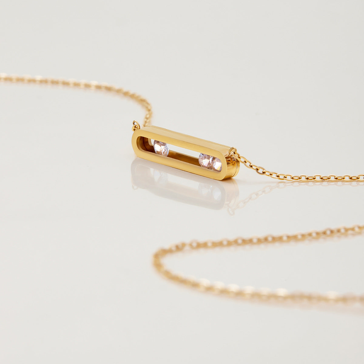 Stackable waterproof gold necklaces with bar detail