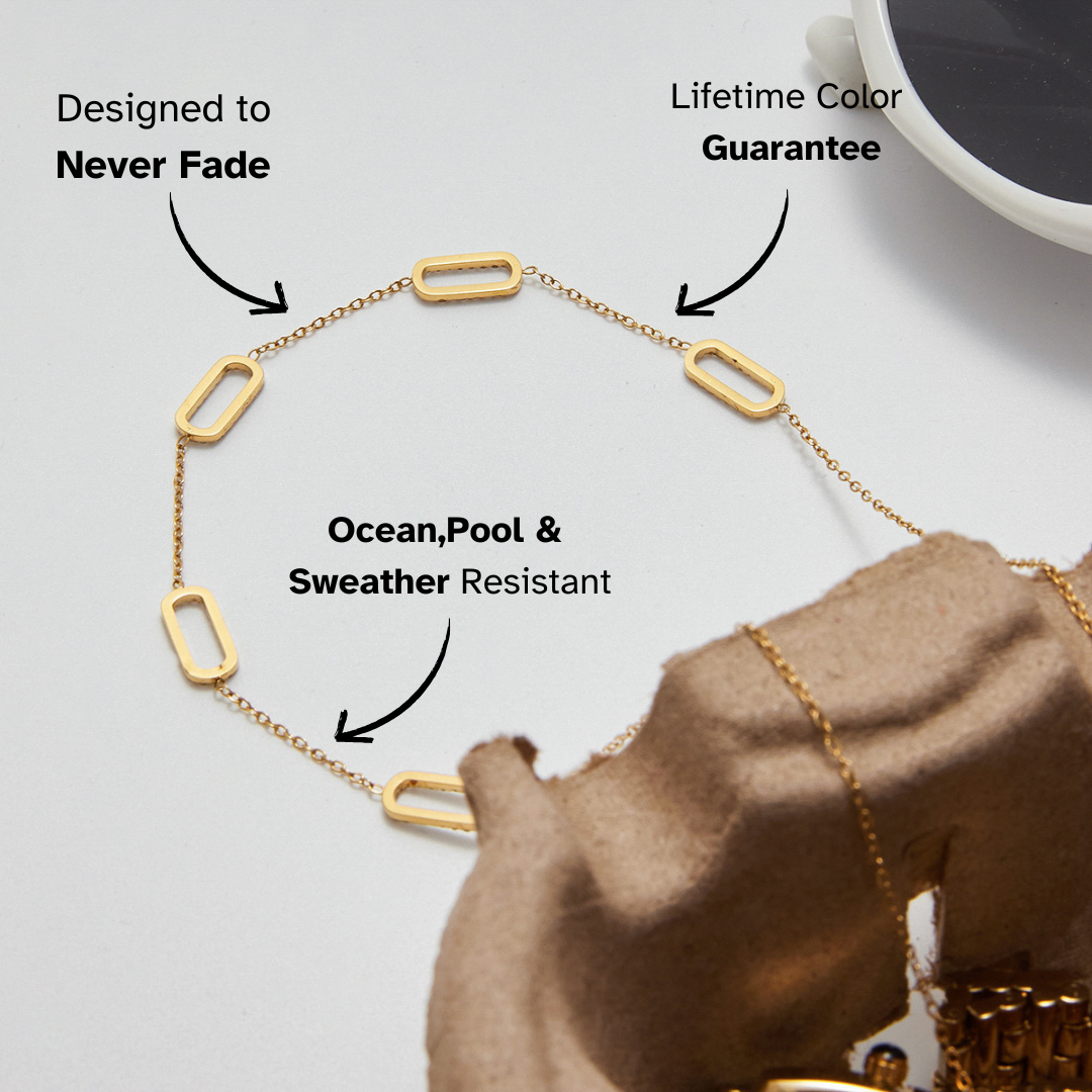 Stylish flat-lay of geometric gold and crystal chain necklace for women.