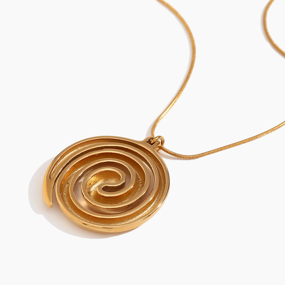 Gold spiral pendant necklace on a white background