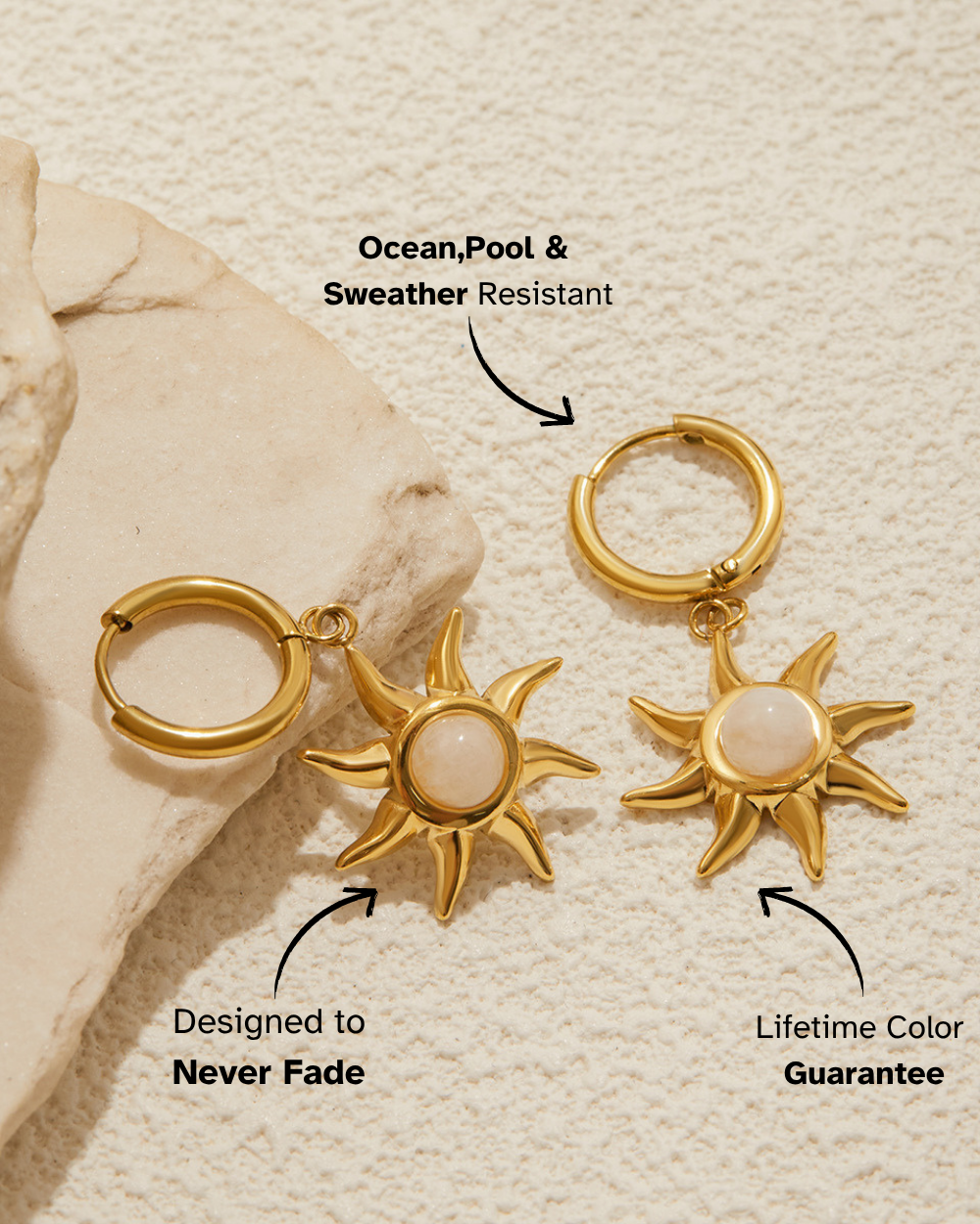 Gold sun-shaped earrings with a beige stone background