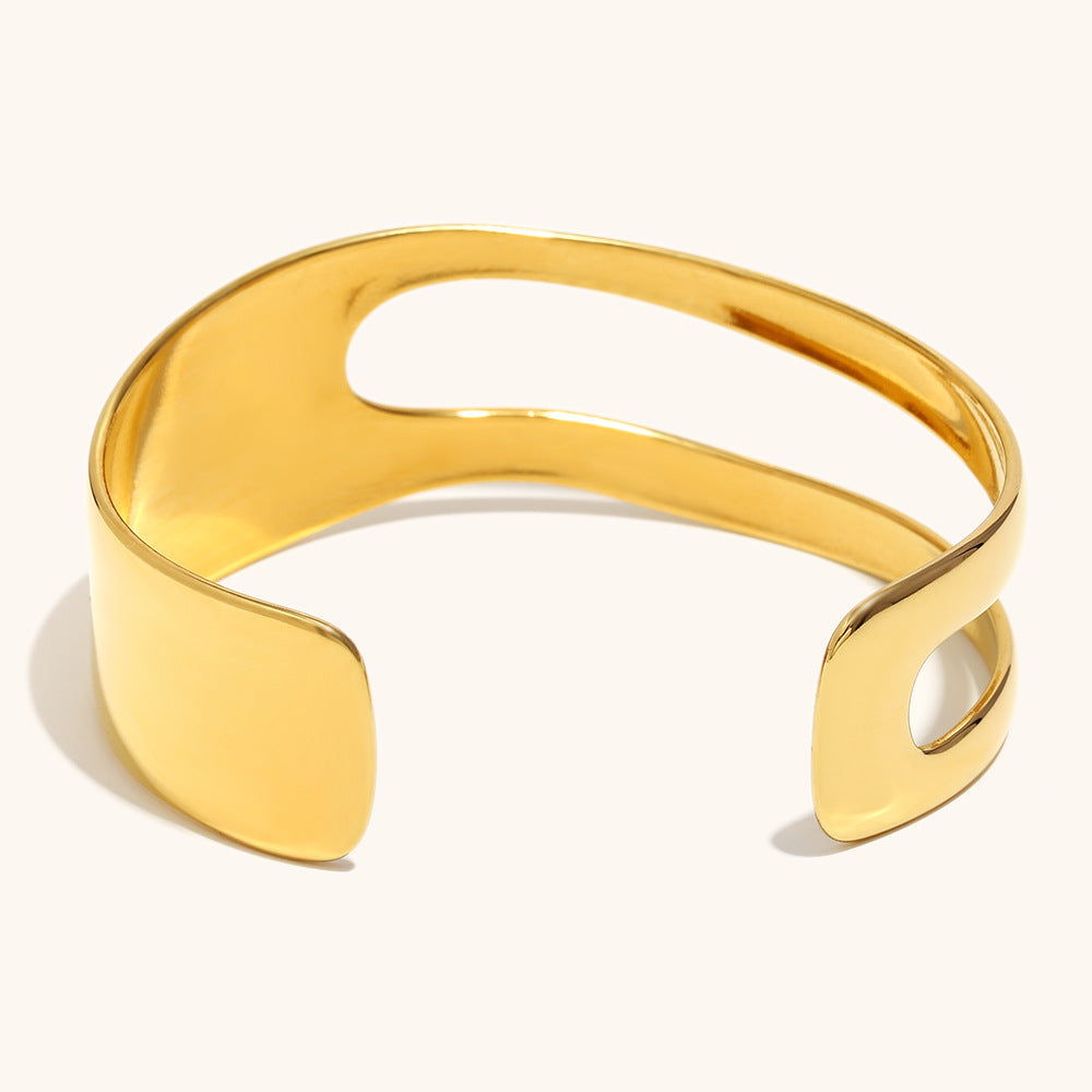 Contemporary chunky gold bangle bracelet for women, wide and polished