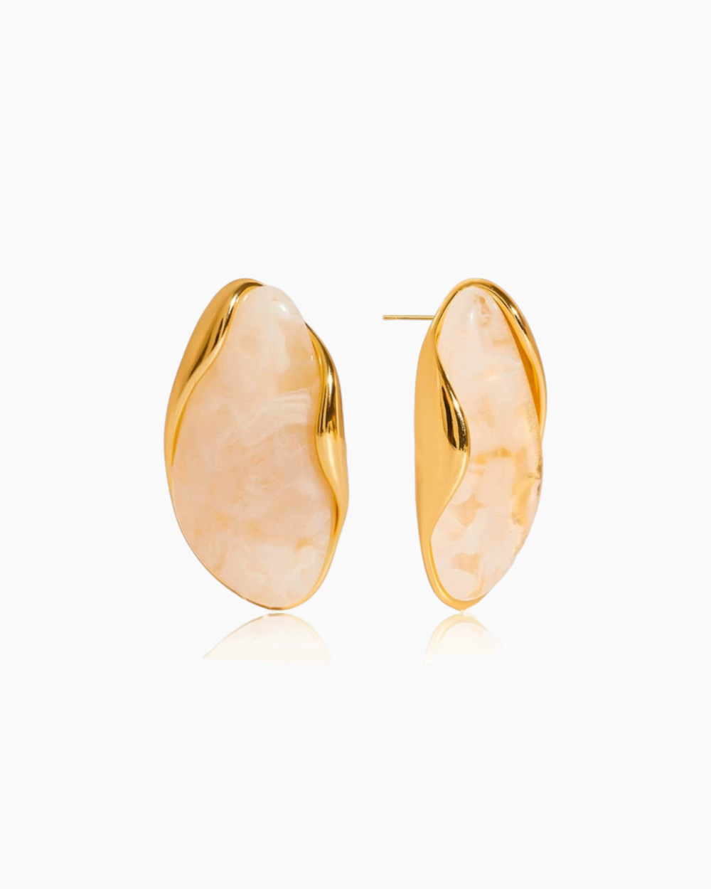 Gold earrings with a textured design on a white background