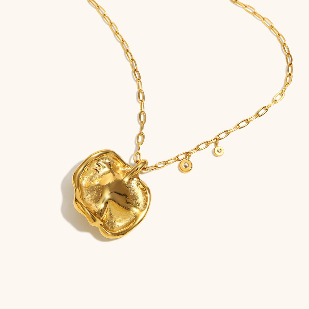 Gold flower pendant necklace with pearl, styled with a chunky chain-back side