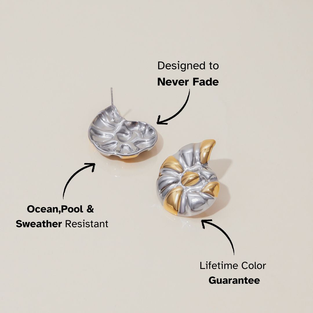 Product shot of shiny swirl earrings in metallic gold and silver tones