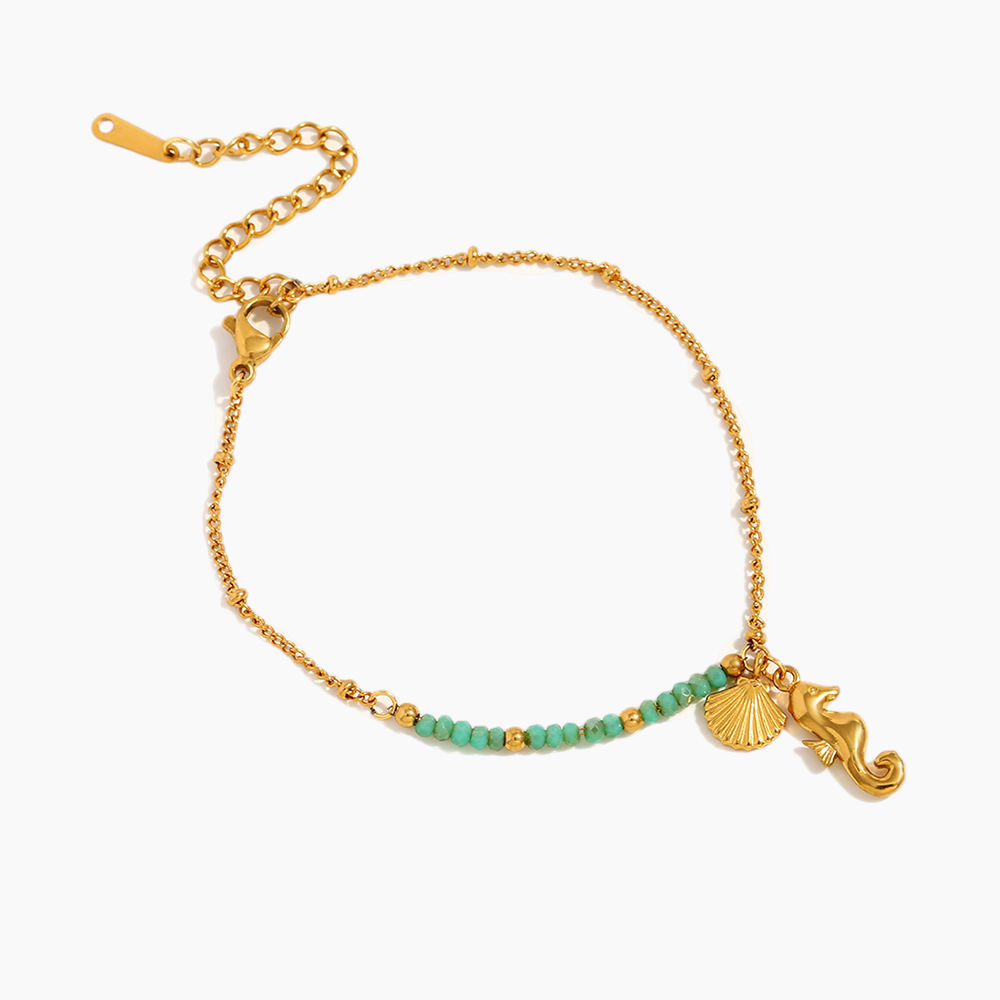 Ocean-inspired seahorse bracelet accenting a casual summer outfit under sunlight
