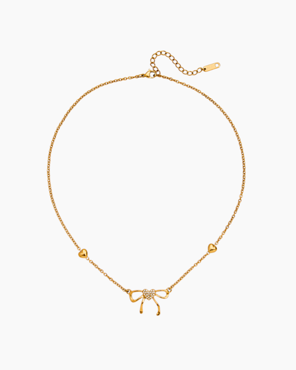 Gold necklace with a bow pendant on a white background