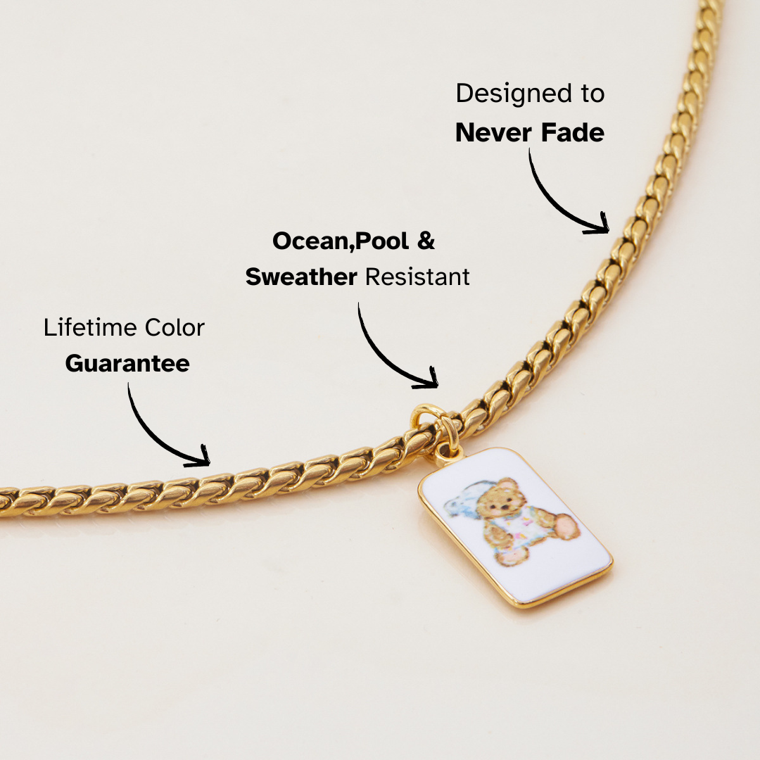 Close-up of bear charm on chunky gold necklace, waterproof and tarnish-resistant