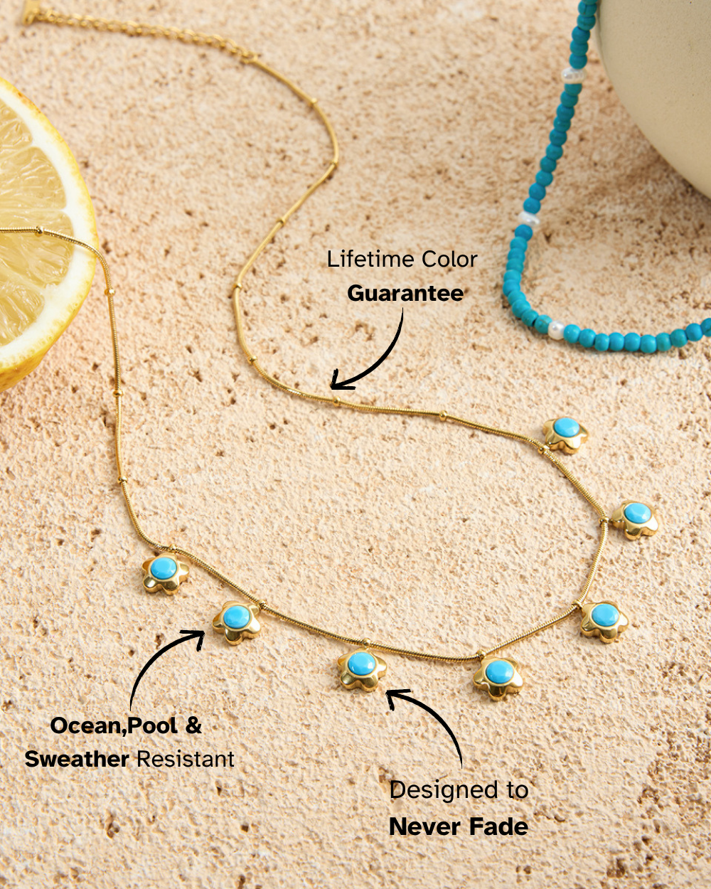 Necklace with turquoise stones on a sandy surface, featuring text about color guarantee and resistance.